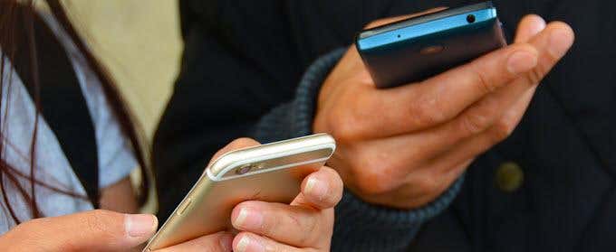 two-friends-sharing-data - Online Tech Tips How Can That be Dangerous? image 3 - two-friends-sharing-data